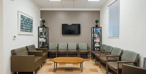 Clean, professional medical spa treatment room with neutral tones at Soma Plastic Surgery in Lake Mary