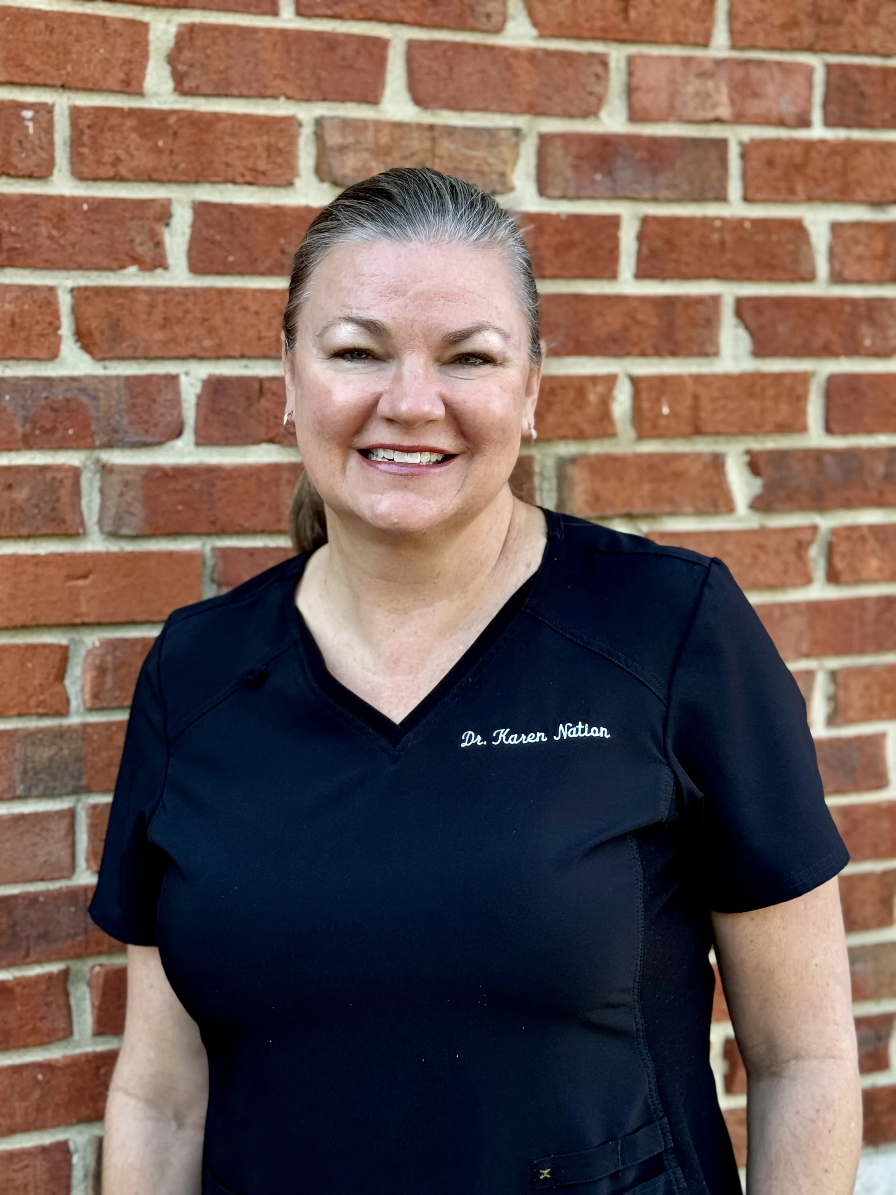 Clean, professional medical spa treatment room with neutral tones at Dr. Karen Nation, DMD in Louisville