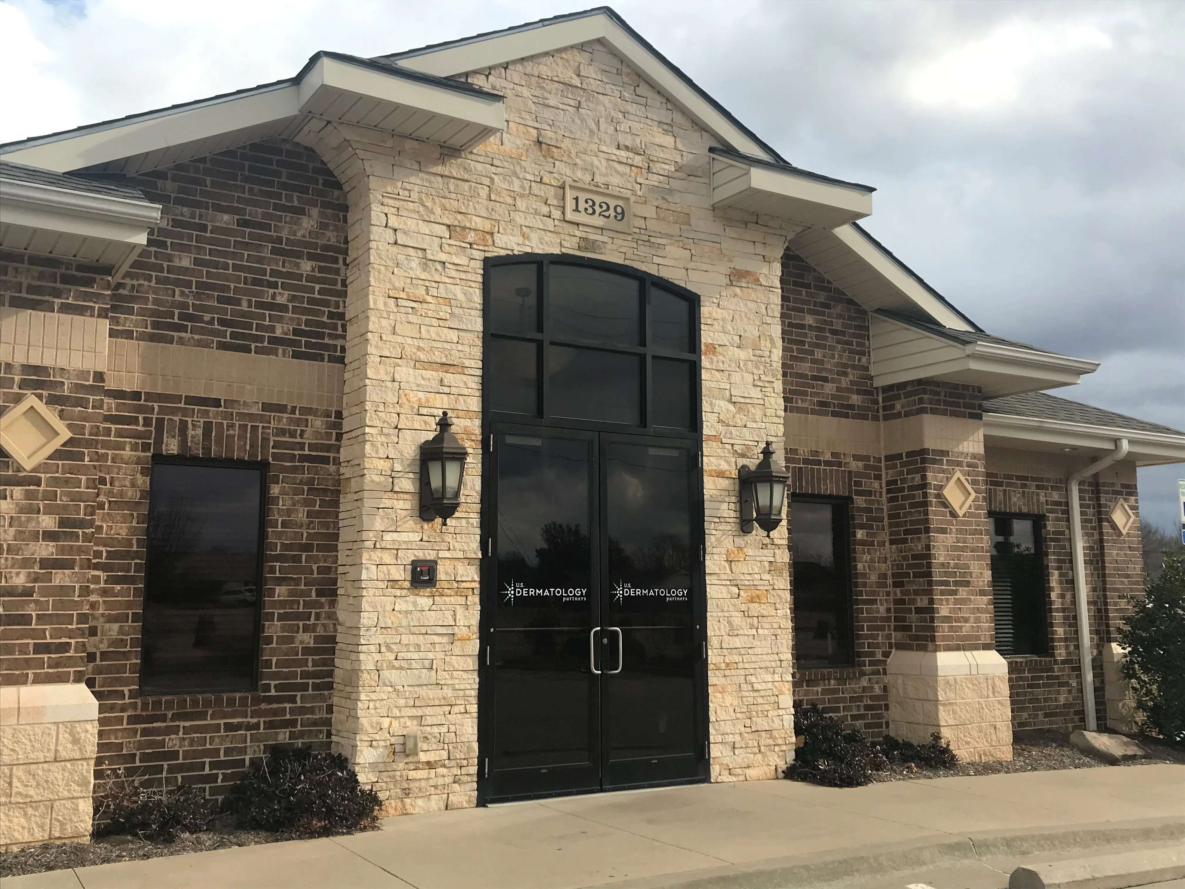 Clean, professional medical spa treatment room with neutral tones at USDP - Stillwater in STILLWATER