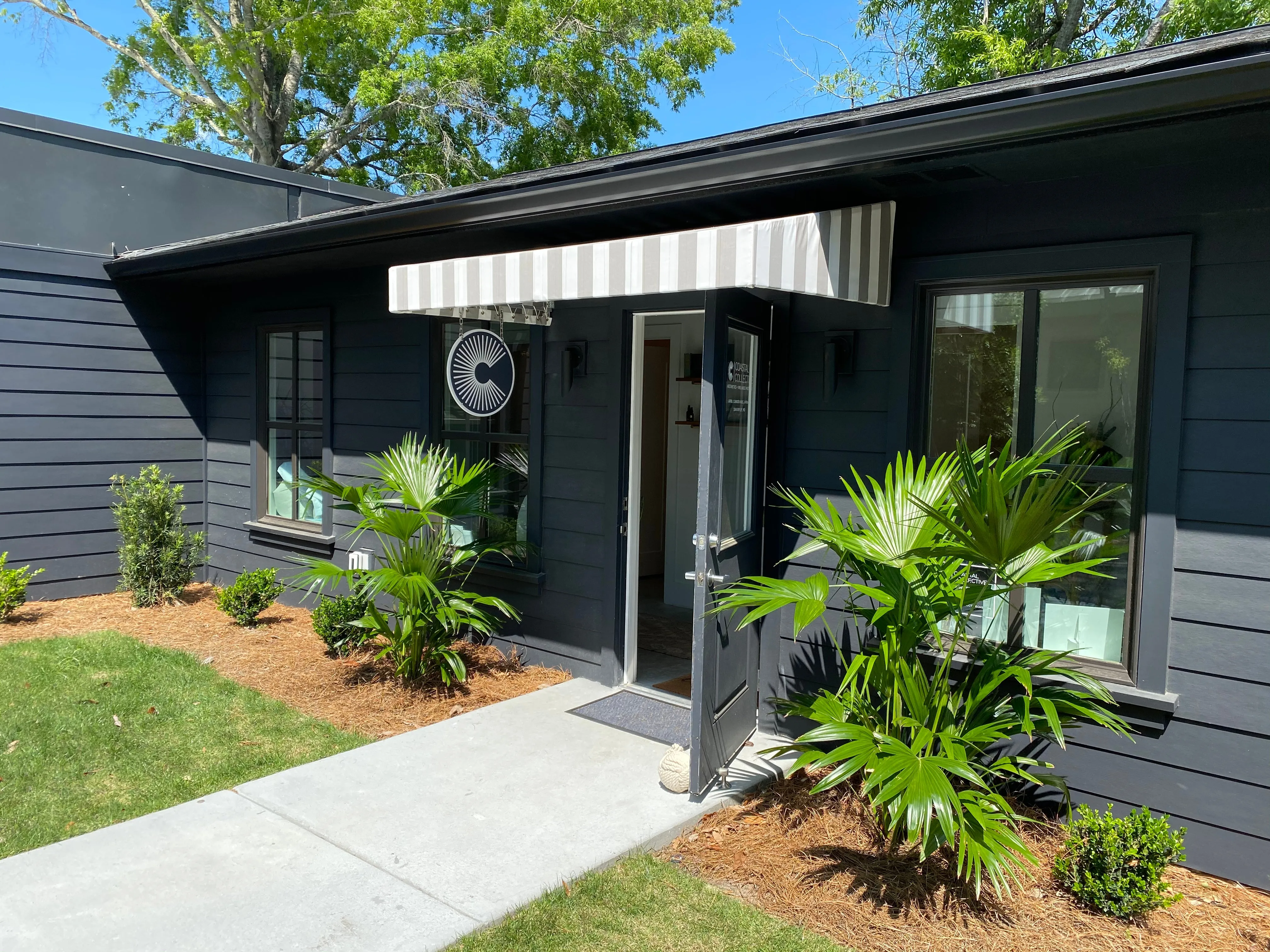 Clean, professional medical spa treatment room with neutral tones at Coastal Collective in Mount Pleasant