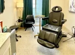 Clean, professional medical spa treatment room with neutral tones at Aesthetica Springdale in Springdale