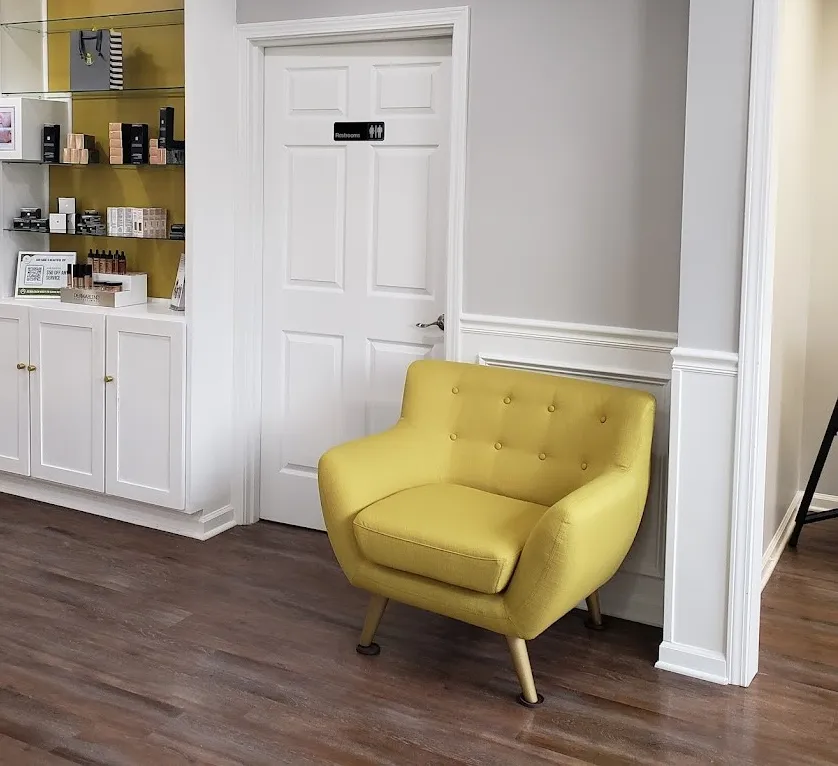 Clean, professional medical spa treatment room with neutral tones at Bare N Beautiful in Anderson
