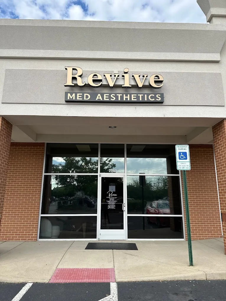 Clean, professional medical spa treatment room with neutral tones at Revive Med Aesthetics in Fredericksburg