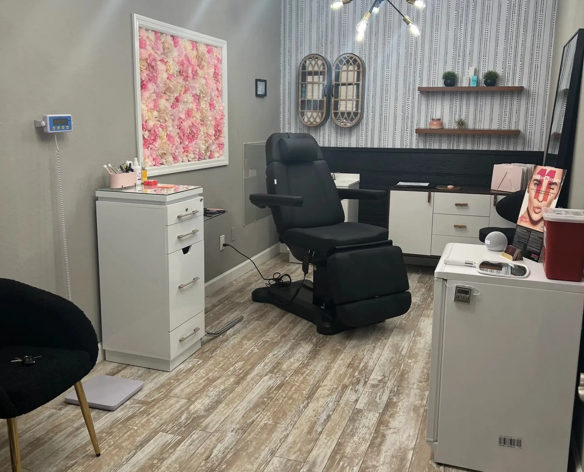 Clean, professional medical spa treatment room with neutral tones at Aesthetics & Wellness By Monic Menard in Port Charlotte