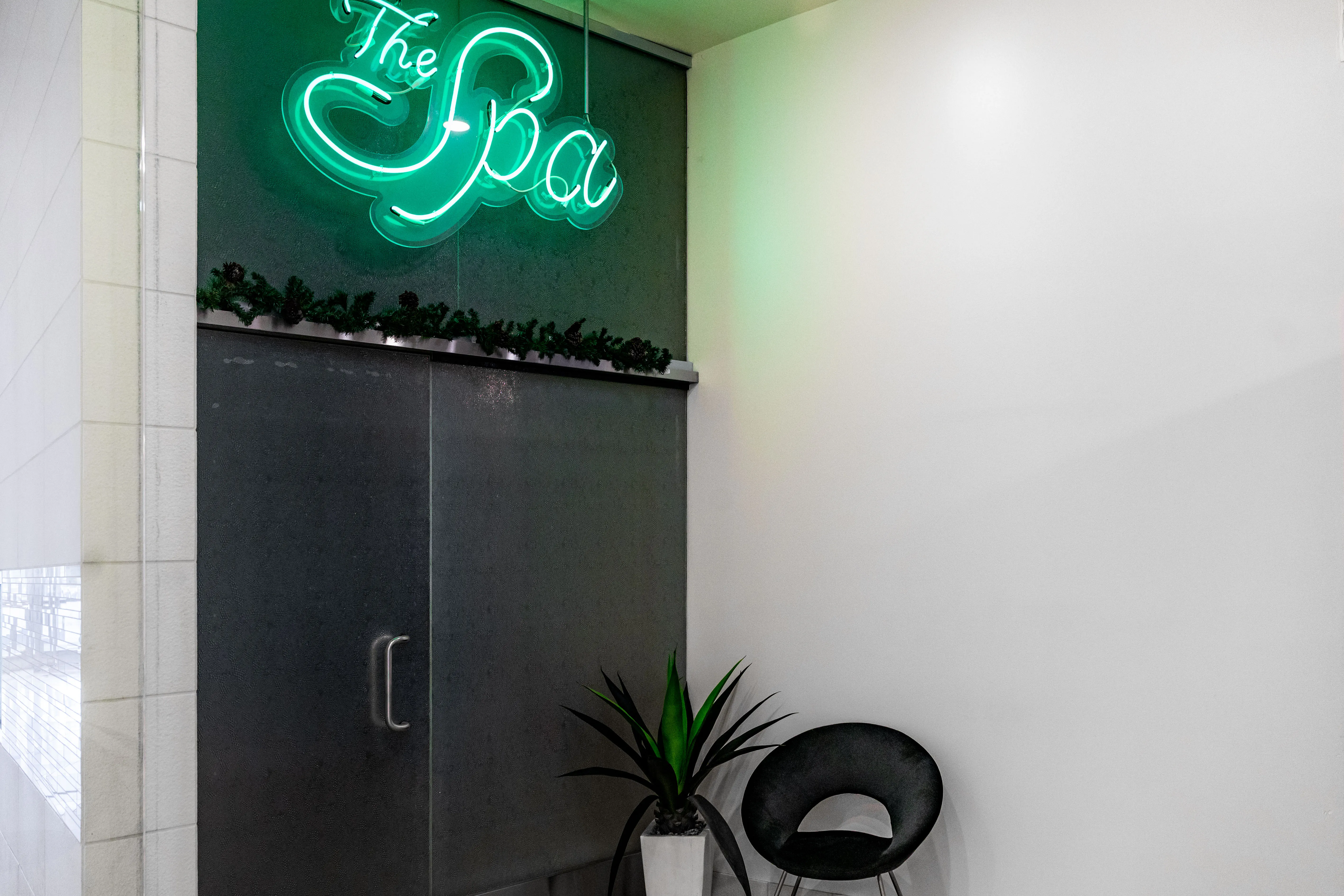 Clean, professional medical spa treatment room with neutral tones at Skinfluence Aesthetics in Novi