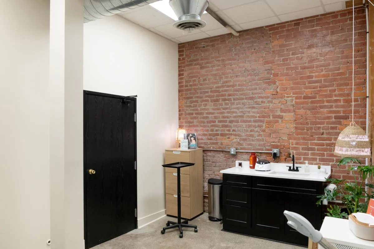 Clean, professional medical spa treatment room with neutral tones at Veda Skin & Laser in Detroit