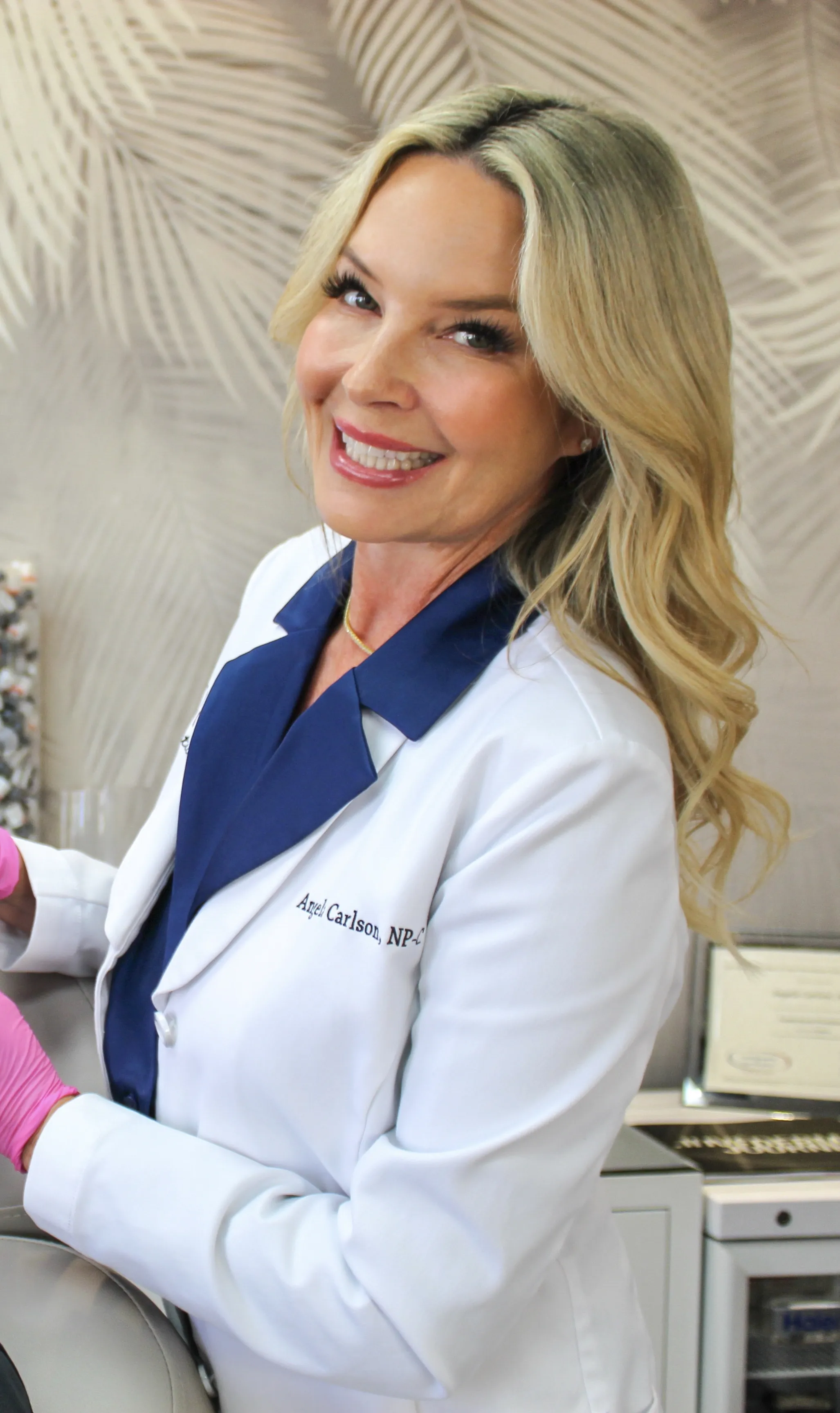Clean, professional medical spa treatment room with neutral tones at Aglow Aesthetics in Huntington Beach