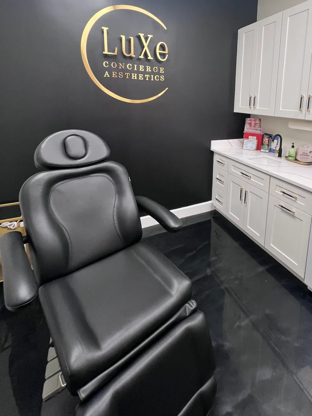 Clean, professional medical spa treatment room with neutral tones at LuXe Concierge Aesthetics in Davie