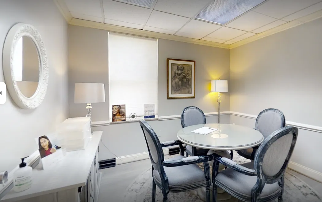 Clean, professional medical spa treatment room with neutral tones at The Sendi Cosmetic Surgery Ctr,Inc. in Alexandria