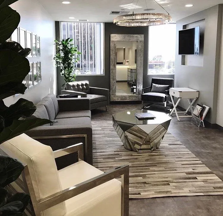 Clean, professional medical spa treatment room with neutral tones at Aaron Kosins MD in Newport Beach