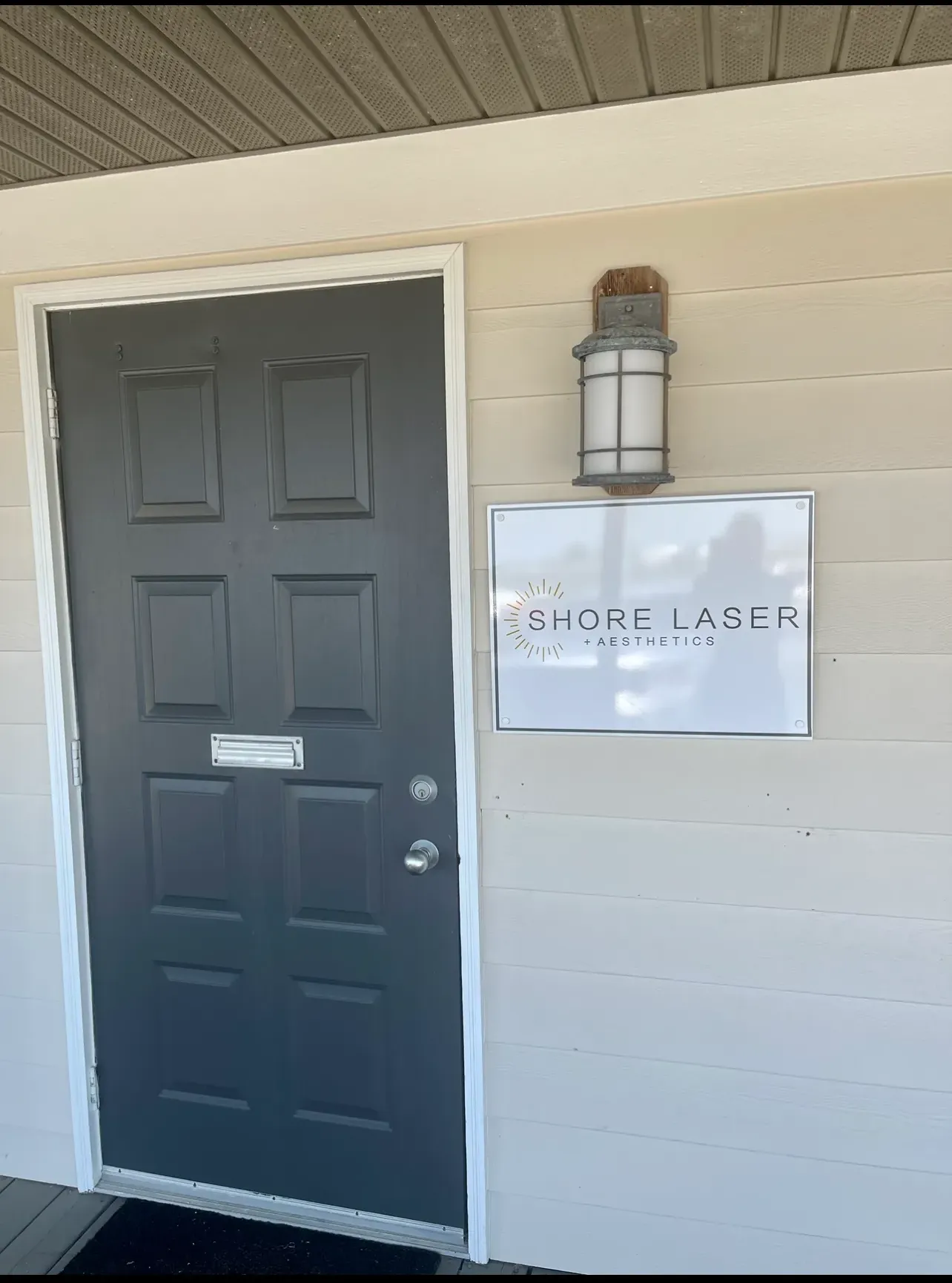 Clean, professional medical spa treatment room with neutral tones at Shore Laser Aesthetics in Pasadena
