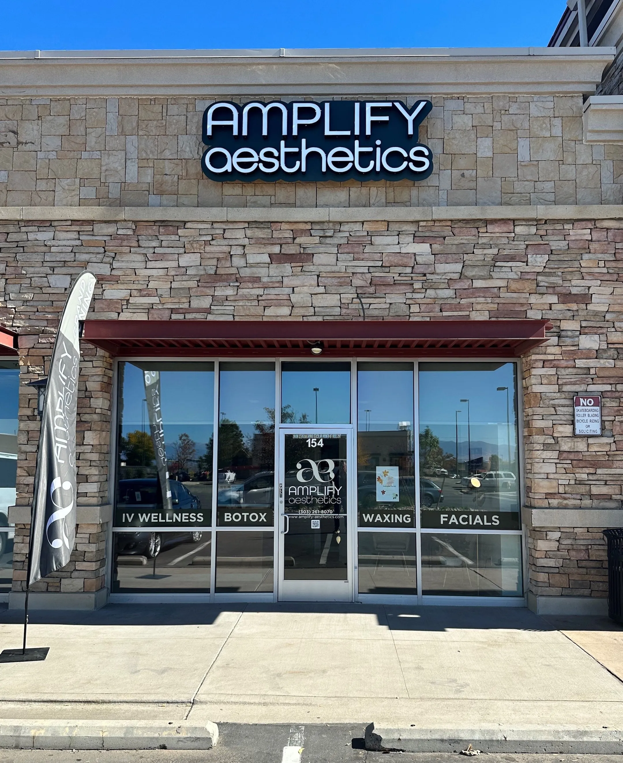Clean, professional medical spa treatment room with neutral tones at Amplify Aesthetics in Thornton
