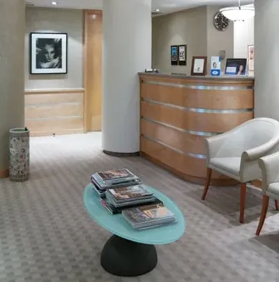Clean, professional medical spa treatment room with neutral tones at John Sherman, M.D. in New York