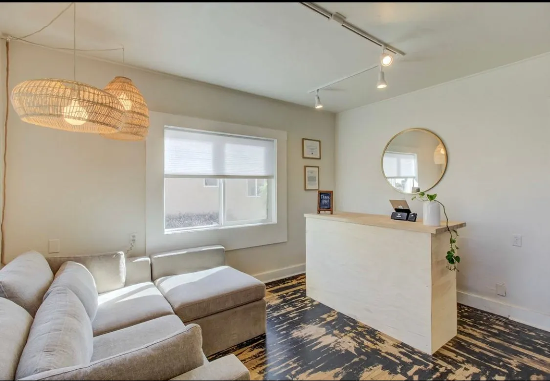 Clean, professional medical spa treatment room with neutral tones at Live By Design in Redding