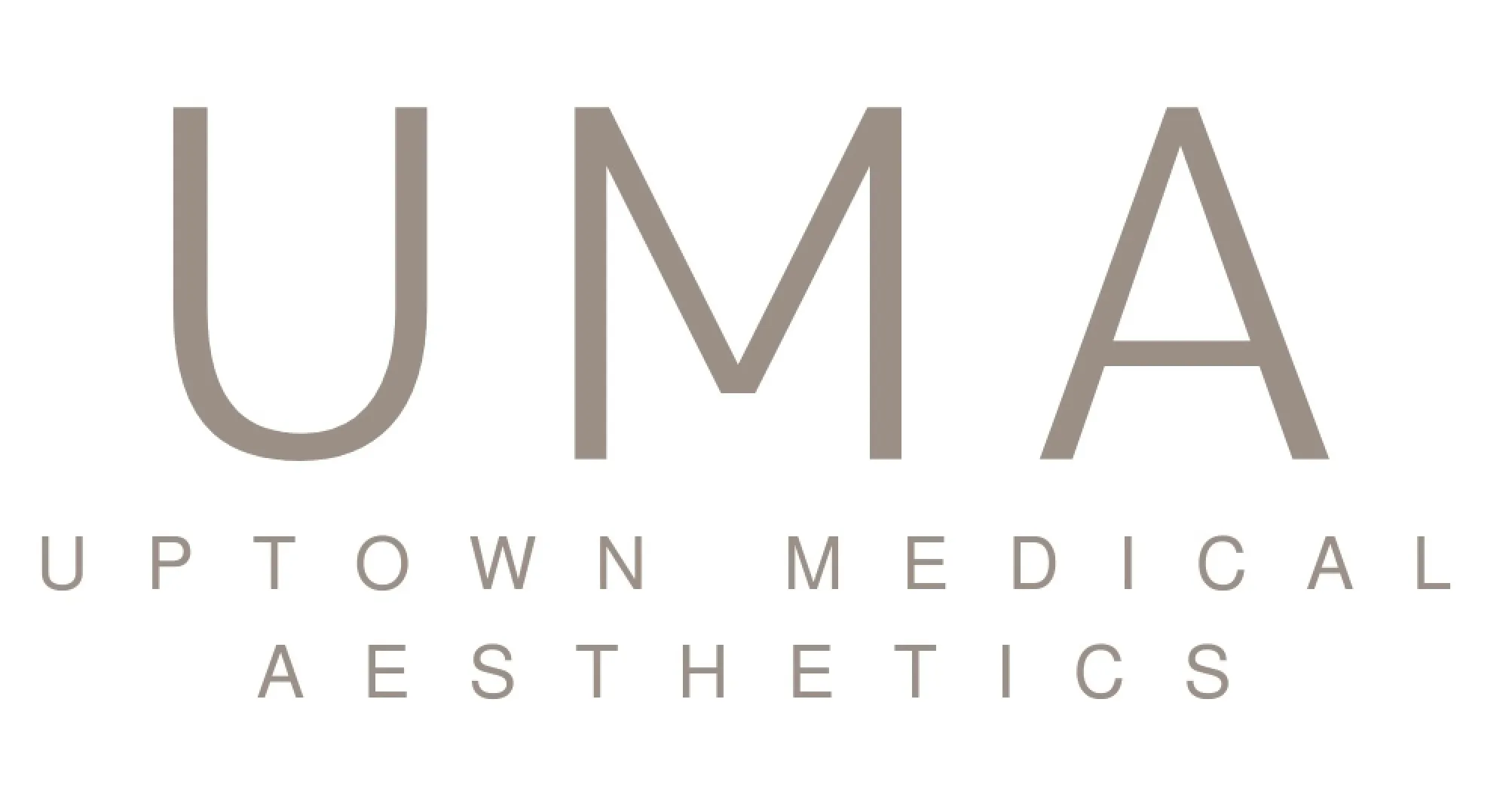 Clean, professional medical spa treatment room with neutral tones at Uptown Medical Aesthetics in Erie