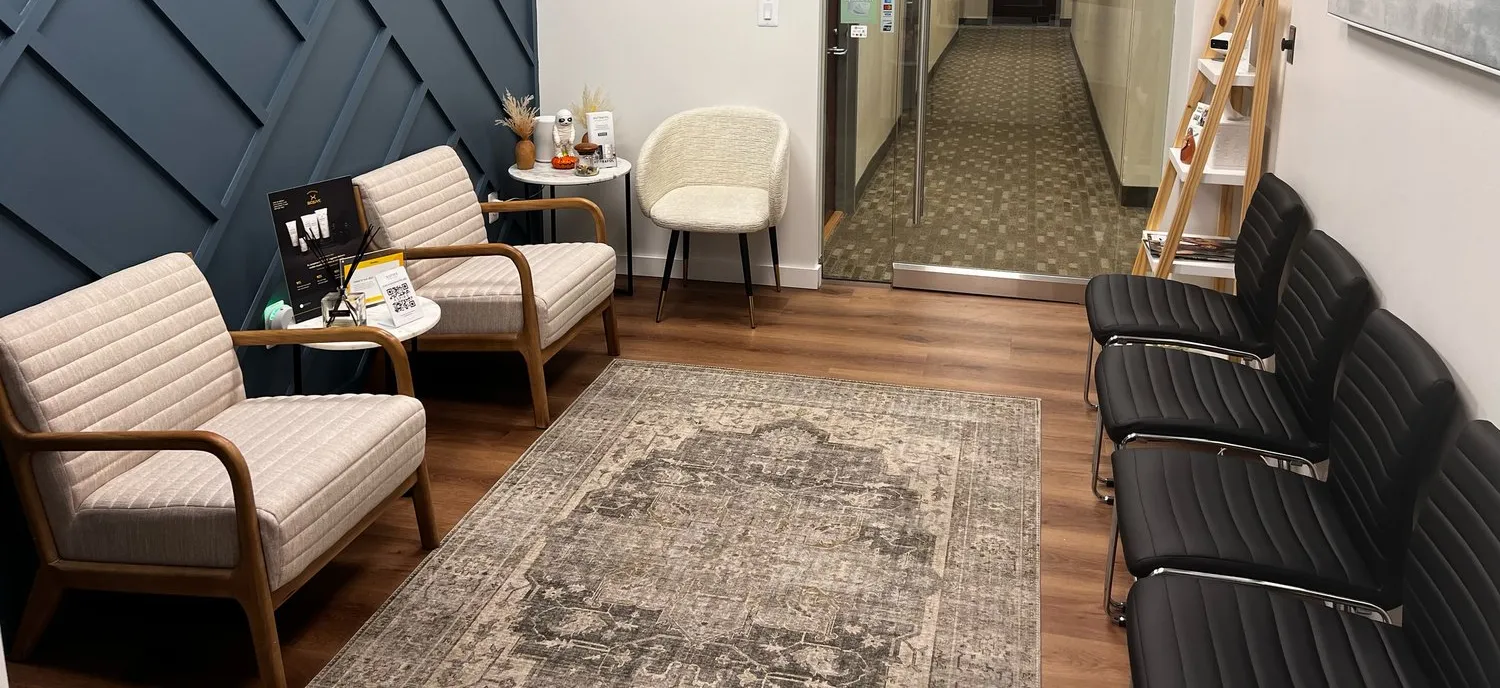Clean, professional medical spa treatment room with neutral tones at Fisher Dermatology & Aesthetics in Chevy Chase