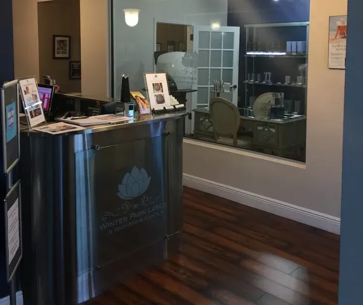 Clean, professional medical spa treatment room with neutral tones at Winter Park Laser & Anti Aging Ctr in Winter Park