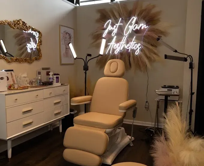 Clean, professional medical spa treatment room with neutral tones at Just Glam Medical Aesthetics in Astoria