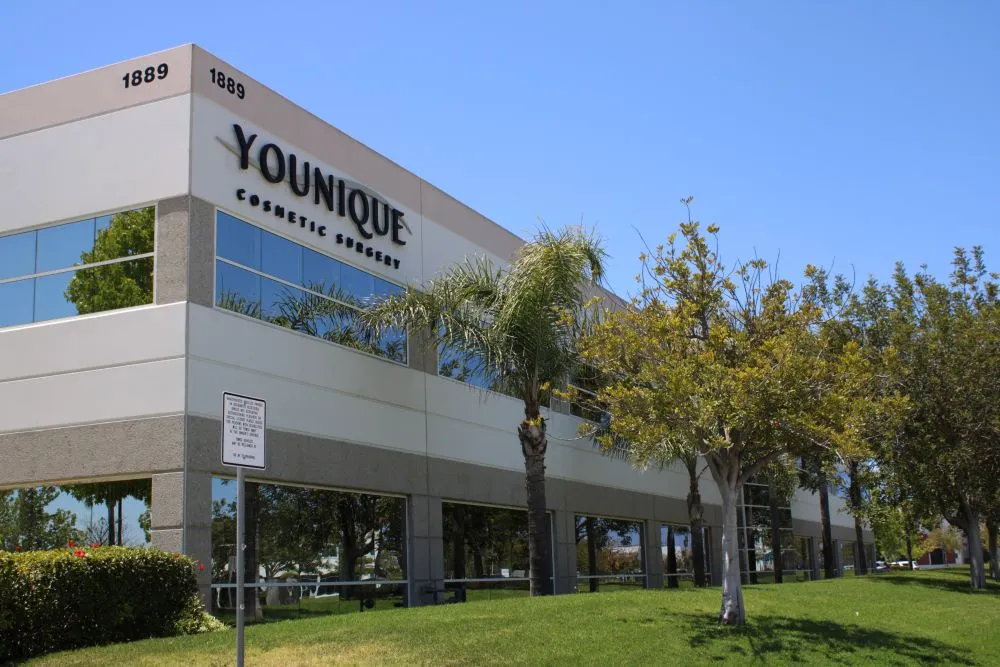 Clean, professional medical spa treatment room with neutral tones at Younique Cosmetic Surgery - Oxnard in Oxnard