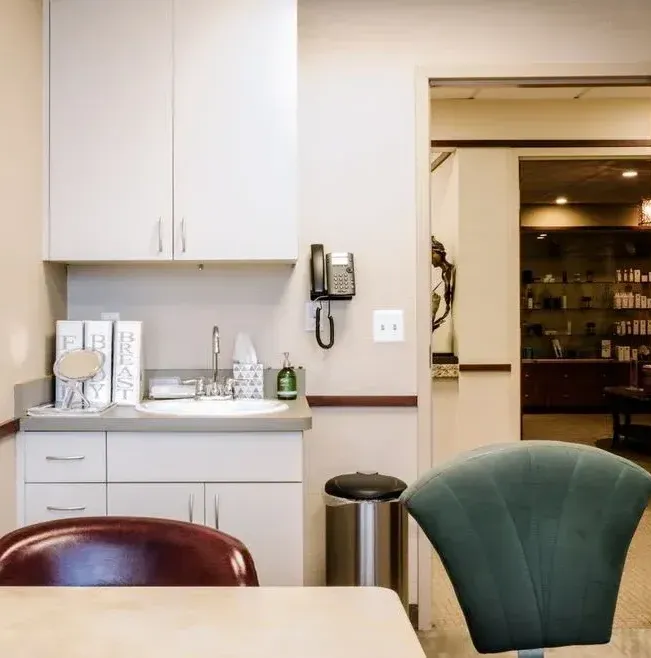 Clean, professional medical spa treatment room with neutral tones at Michael H. Freedland, MD in Bloomfield Hills