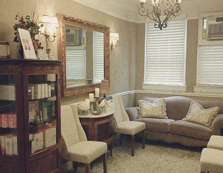 Clean, professional medical spa treatment room with neutral tones at Lewis Dermatology & Associates in New York