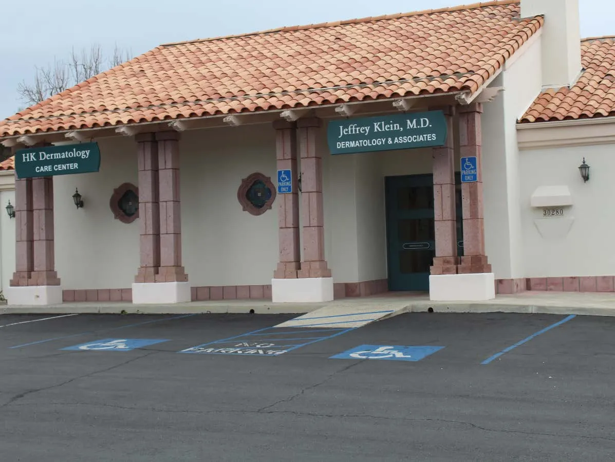 Clean, professional medical spa treatment room with neutral tones at HK Dermatology in San Juan Capistrano