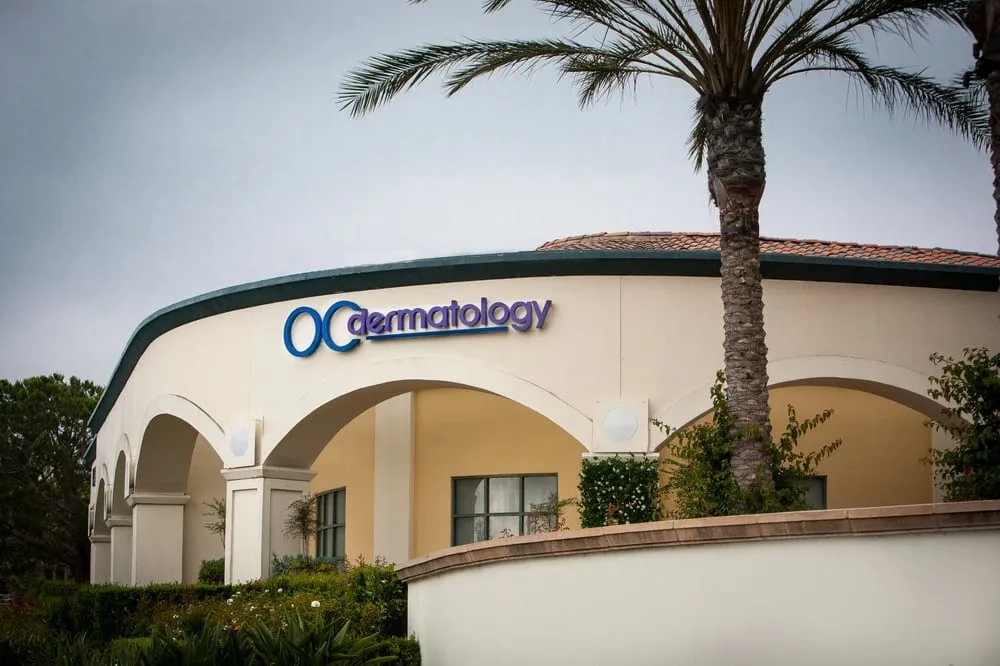 Clean, professional medical spa treatment room with neutral tones at OC Dermatology in Laguna Niguel