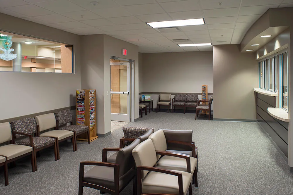 Clean, professional medical spa treatment room with neutral tones at Forefront Dermatology -Cedar Rapids in Cedar Rapids