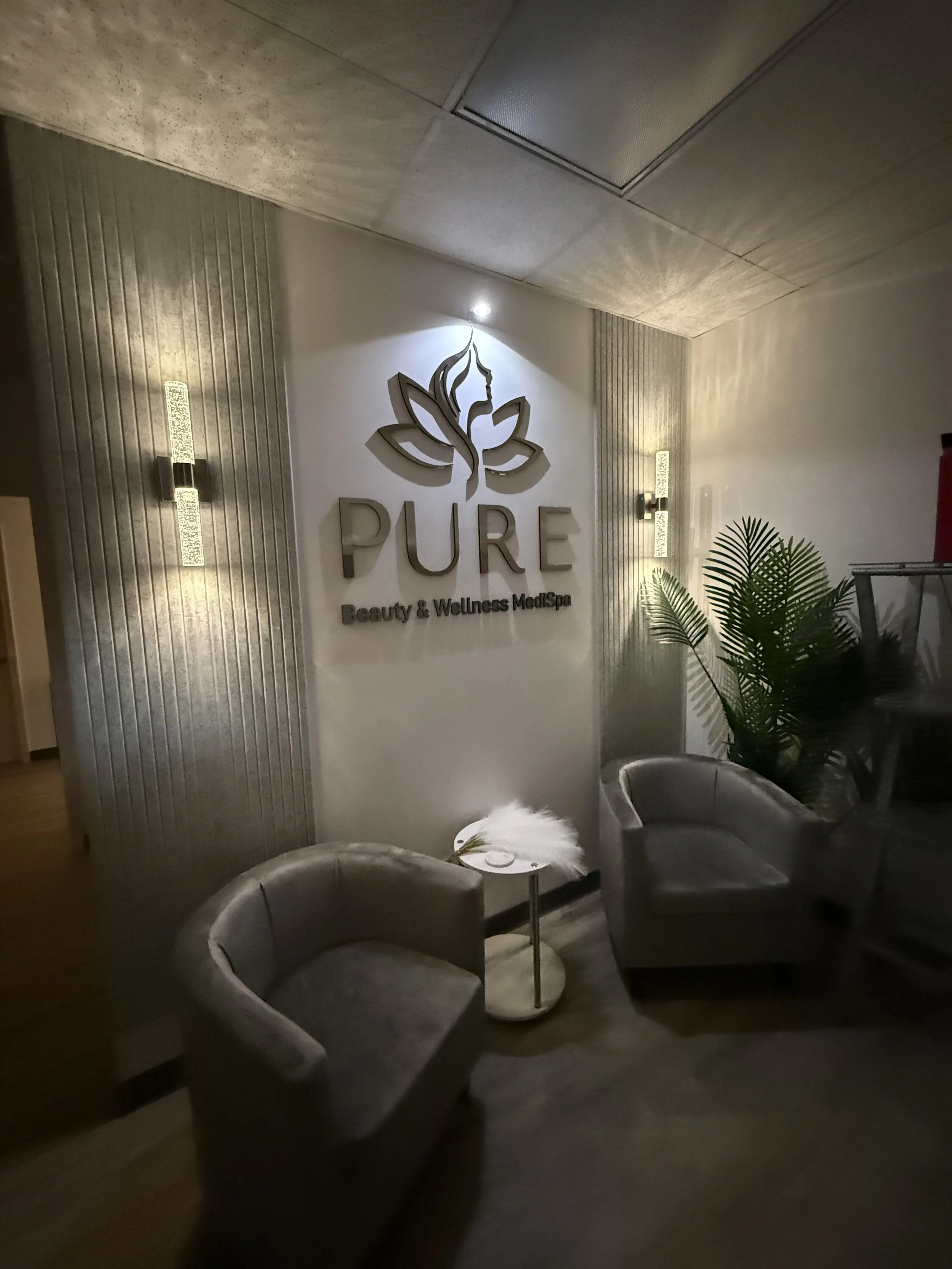 Clean, professional medical spa treatment room with neutral tones at Pure Beauty & Wellness MediSpa in Newport News