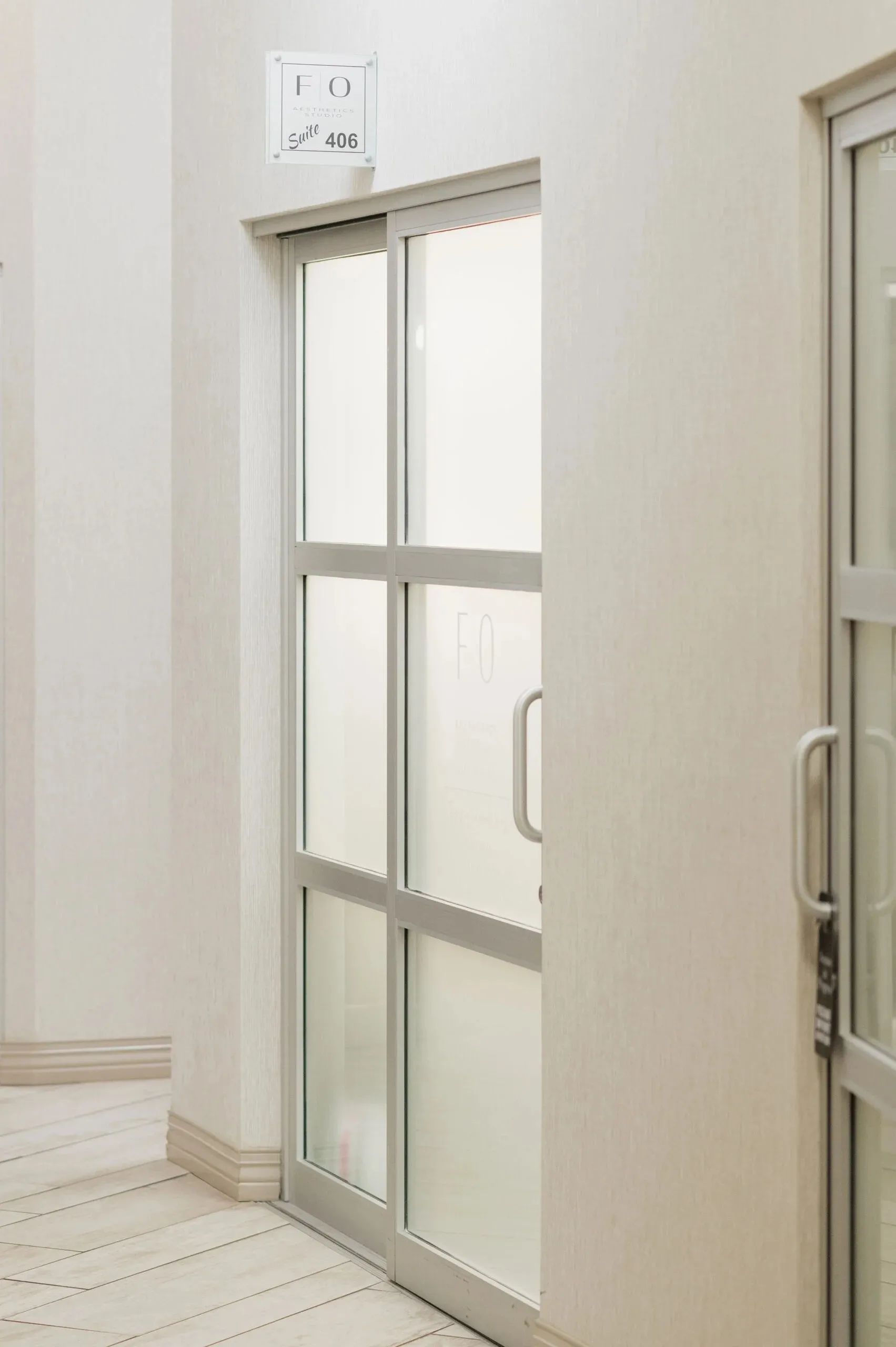 Clean, professional medical spa treatment room with neutral tones at FO Aesthetics Studio in Bel Air
