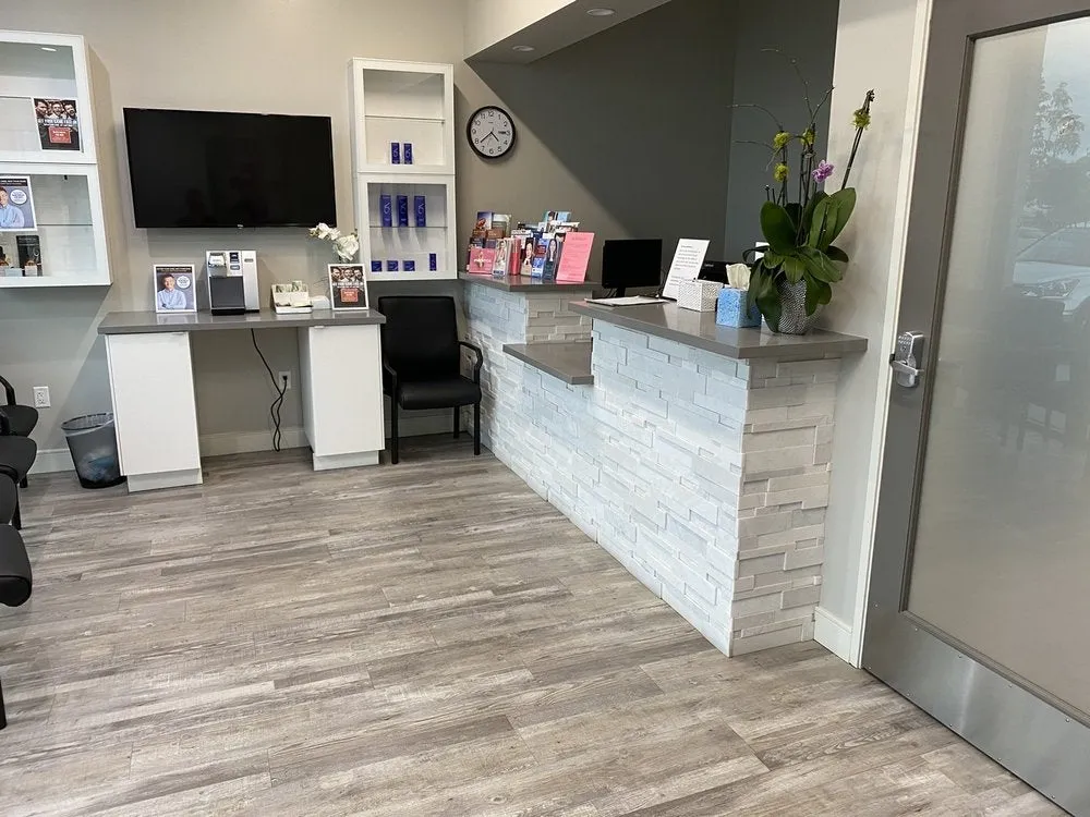 Clean, professional medical spa treatment room with neutral tones at Pacific Derm Specialists Seal Beach in Seal Beach