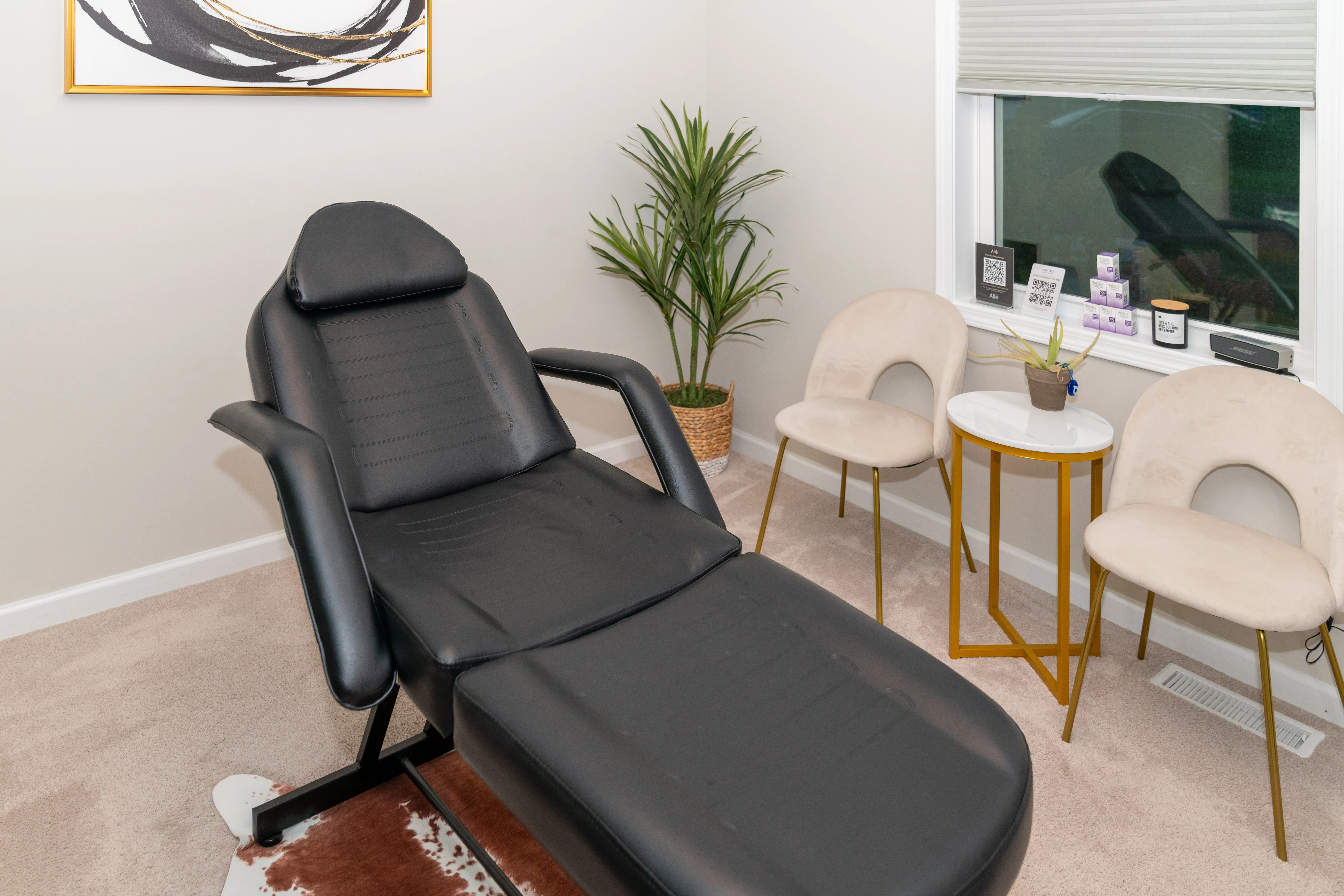 Clean, professional medical spa treatment room with neutral tones at Lauren Halaris FNP in Penfield