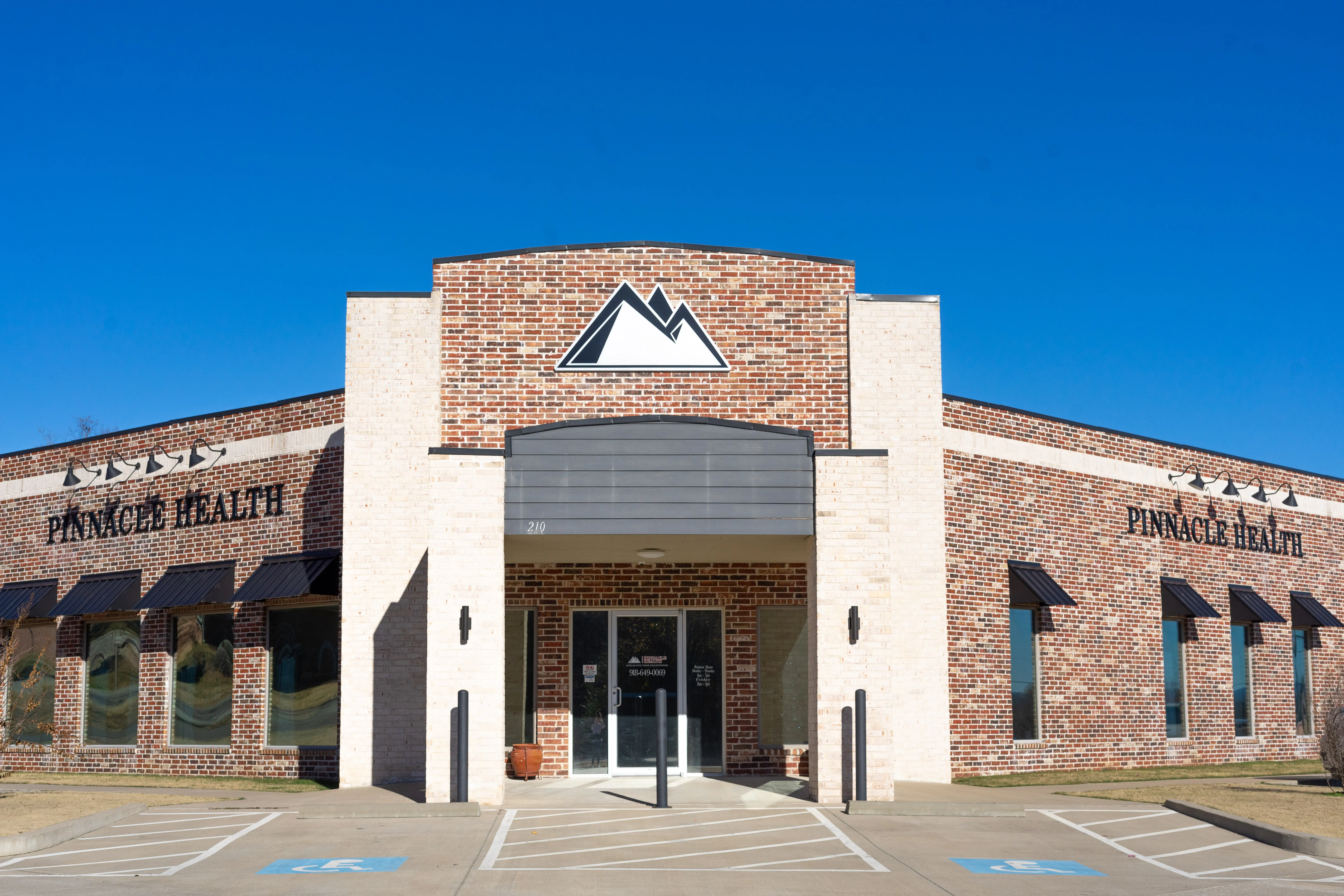 Clean, professional medical spa treatment room with neutral tones at Pinnacle Health in Poteau