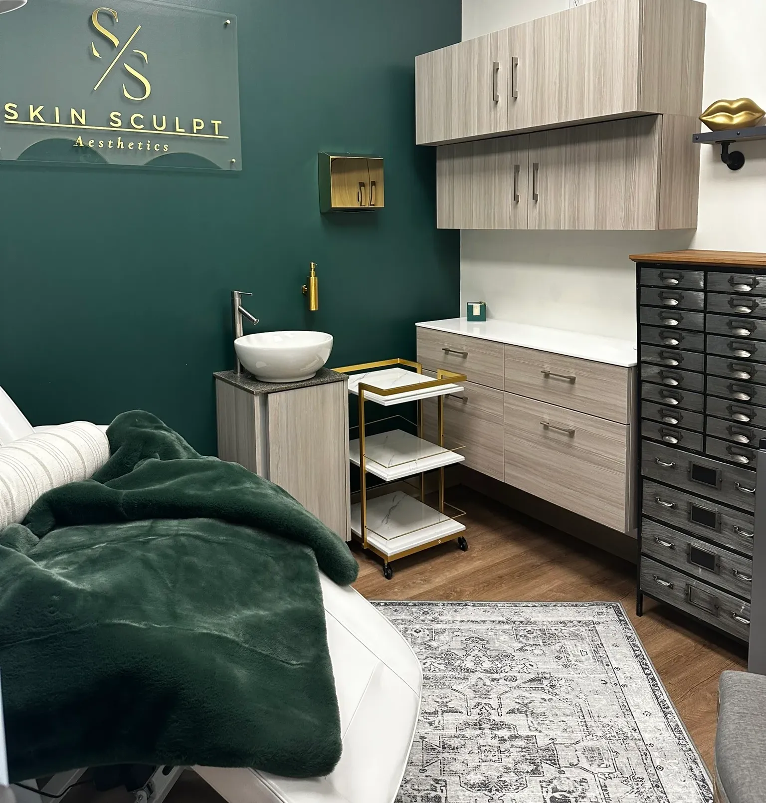 Clean, professional medical spa treatment room with neutral tones at Skinsculpt Aesthetics in Fresno