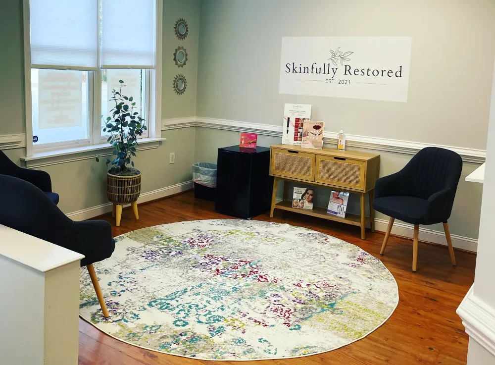 Clean, professional medical spa treatment room with neutral tones at Skinfully Restored in Camden