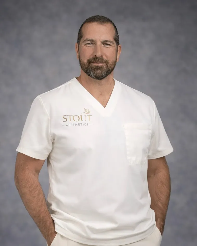 Clean, professional medical spa treatment room with neutral tones at Stout Aesthetics in Brecksville