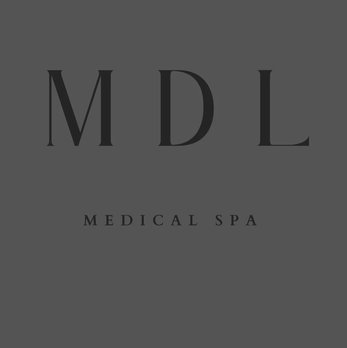 Clean, professional medical spa treatment room with neutral tones at MDL in Jefferson