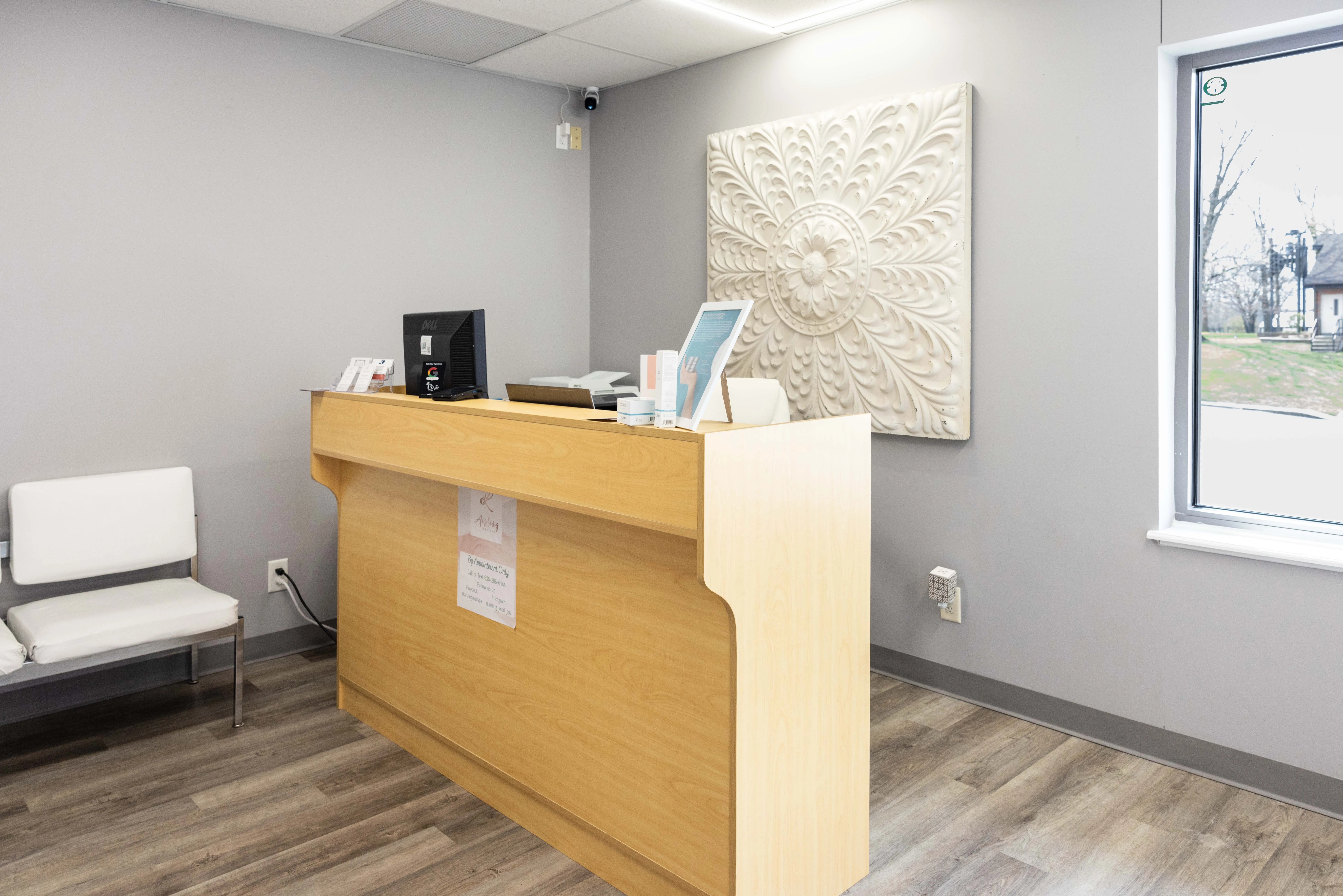 Clean, professional medical spa treatment room with neutral tones at Aisling Med Spa, LLC in New Melle