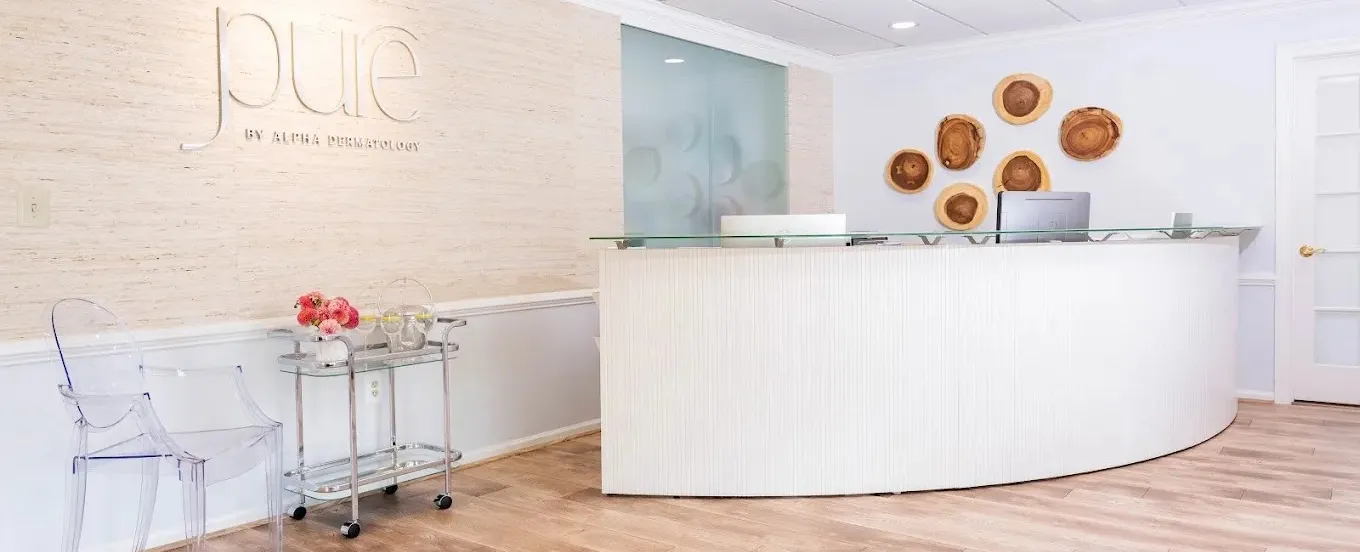Clean, professional medical spa treatment room with neutral tones at PURE By Alpha Dermatology in New Hope