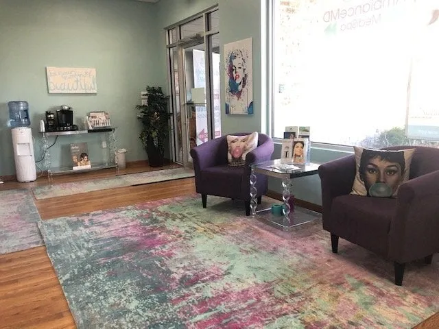 Clean, professional medical spa treatment room with neutral tones at Ambiance MD in Green Bay