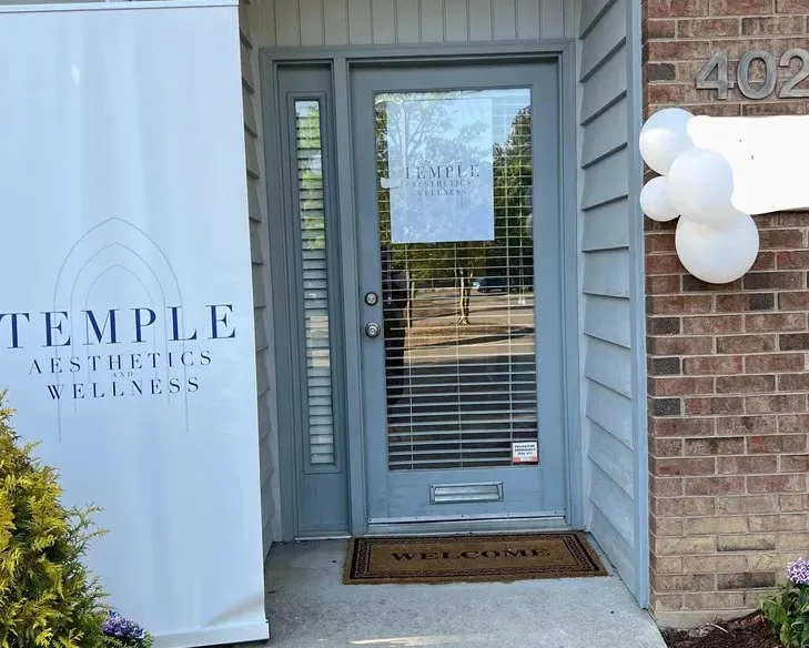 Clean, professional medical spa treatment room with neutral tones at Temple Aesthetics and Wellness in Durham