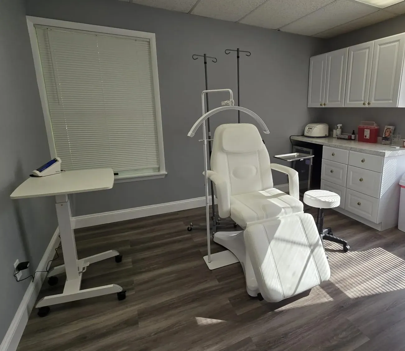 Clean, professional medical spa treatment room with neutral tones at Recharged Beauty & Wellness in Montrose