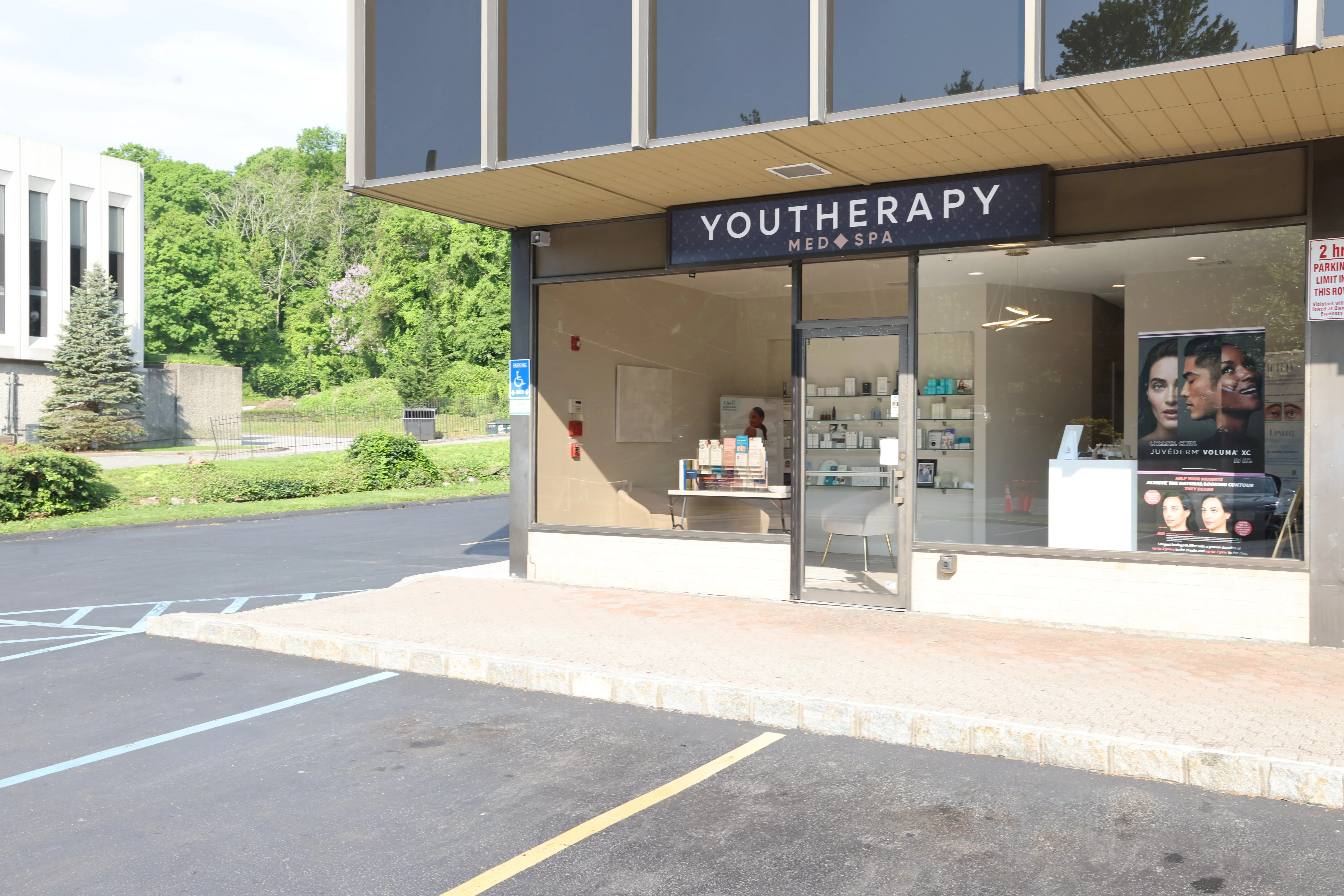 Clean, professional medical spa treatment room with neutral tones at Youtherapy Scarsdale in Scarsdale