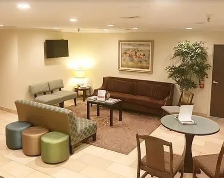 Clean, professional medical spa treatment room with neutral tones at Island Dermatology in Newport Beach
