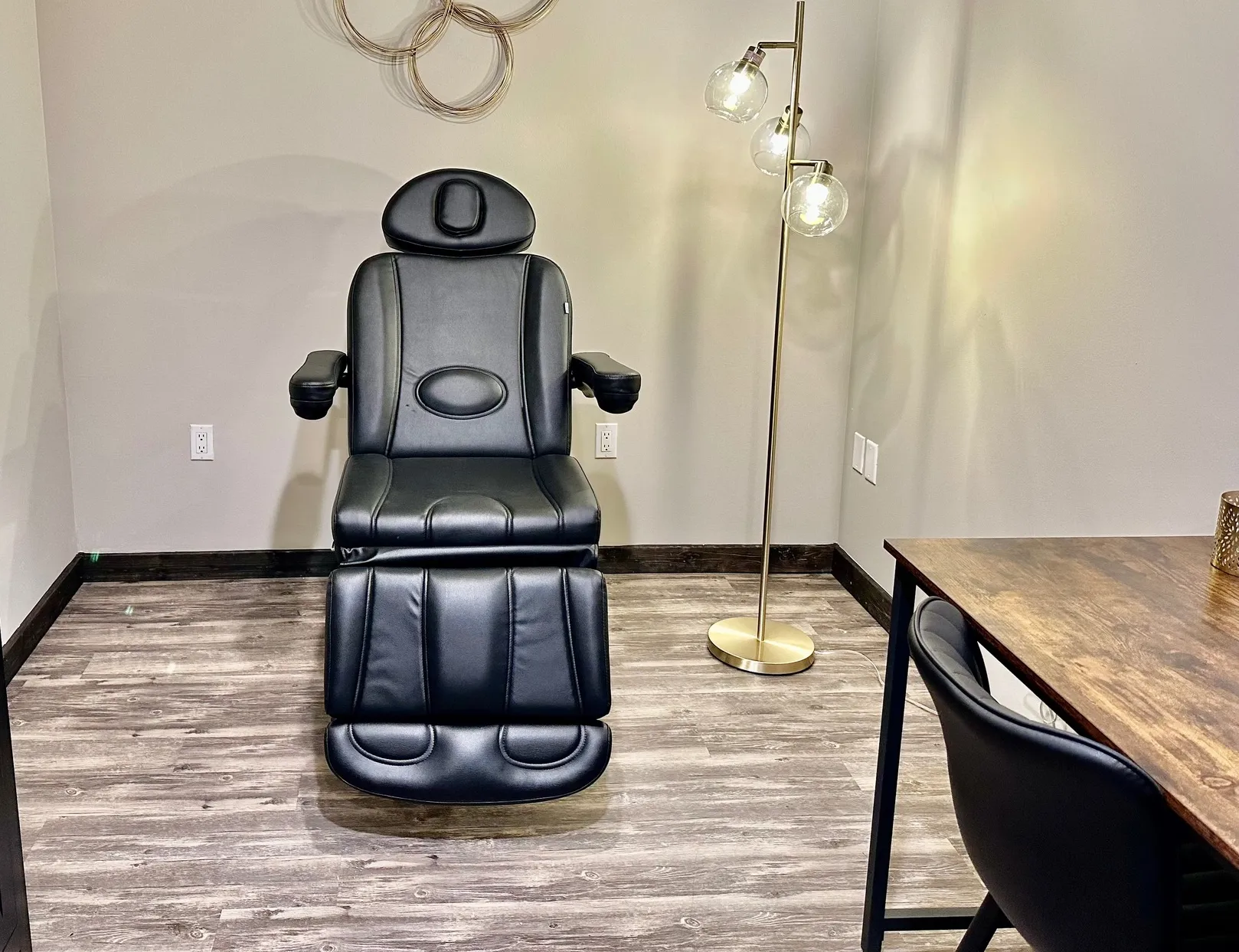 Clean, professional medical spa treatment room with neutral tones at Thrive Aesthetics & Wellness LLC in Fairlawn