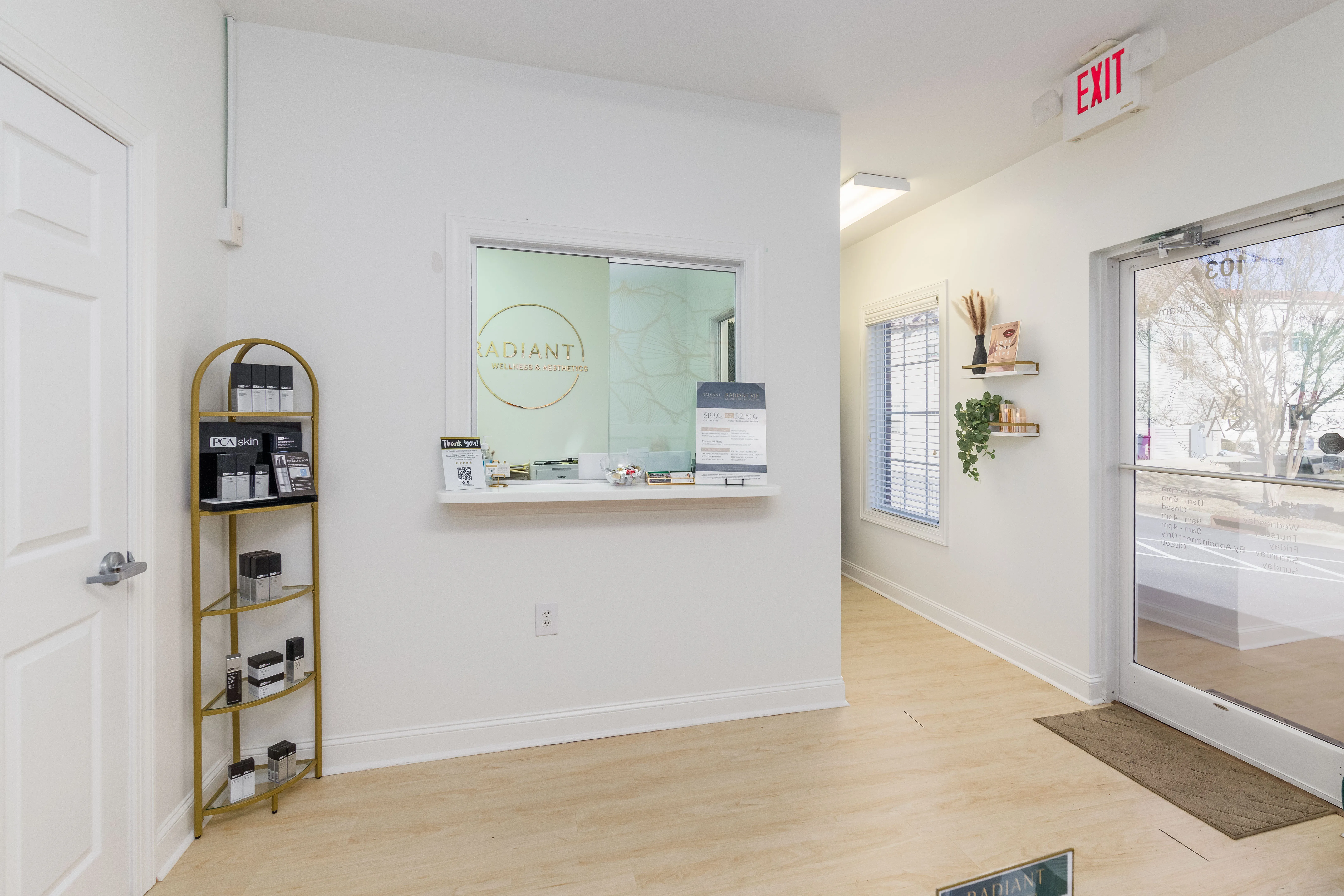 Clean, professional medical spa treatment room with neutral tones at Radiant Wellness & Aesthetics in Fayetteville