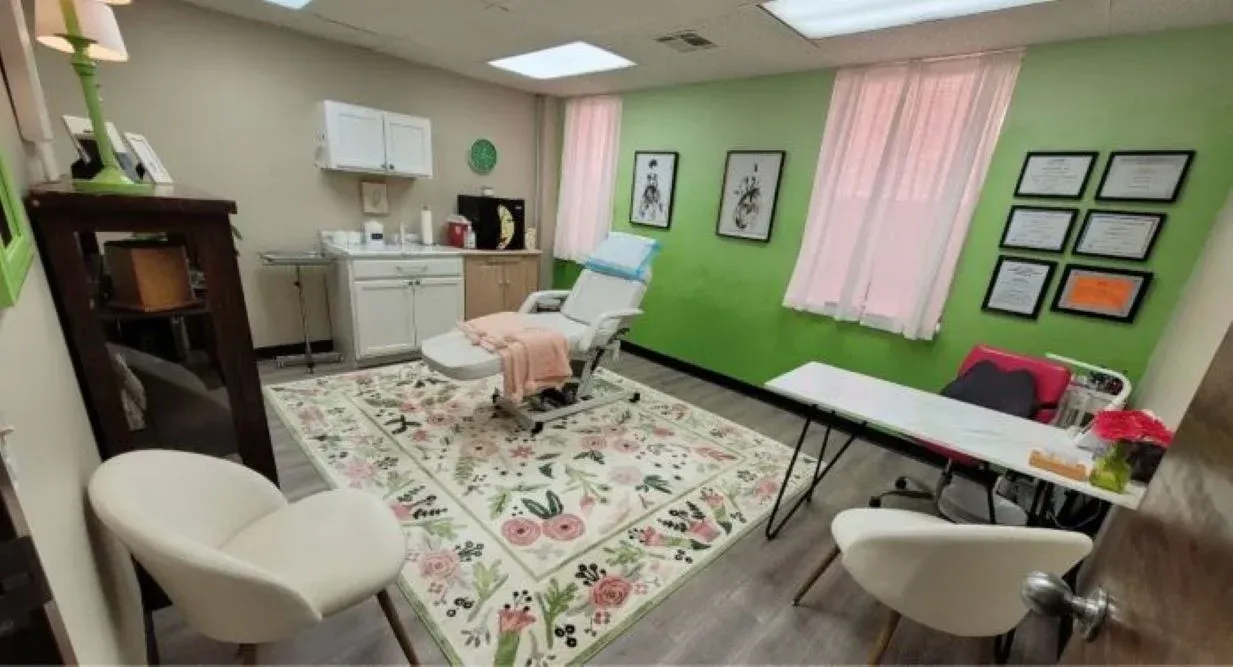 Clean, professional medical spa treatment room with neutral tones at Face the World in Charleston