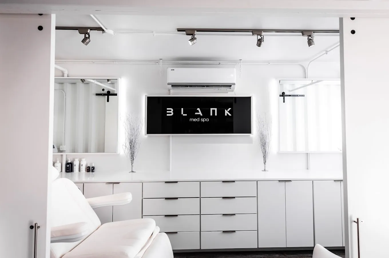 Clean, professional medical spa treatment room with neutral tones at Blank Medspa in Tulsa