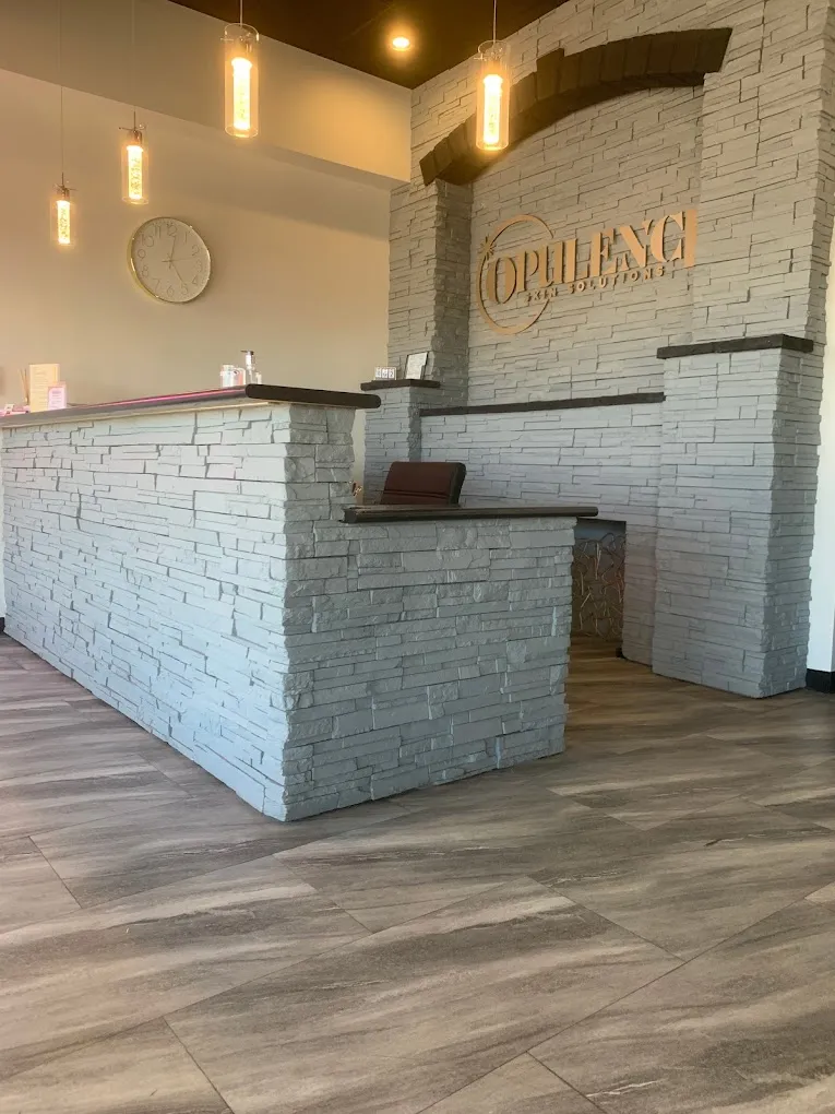 Clean, professional medical spa treatment room with neutral tones at Opulence Skin Solutions in Castle Rock