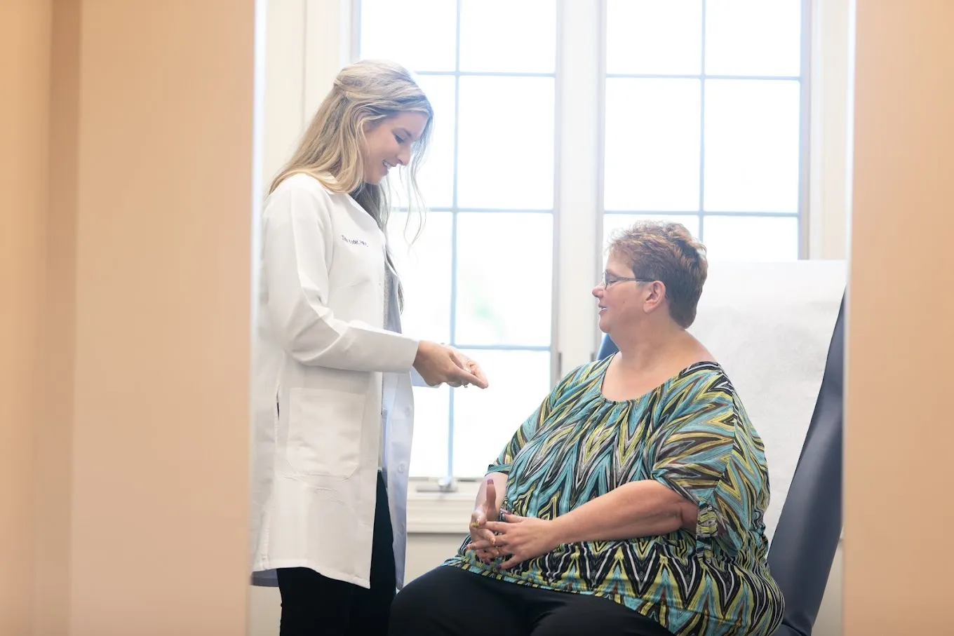 Clean, professional medical spa treatment room with neutral tones at Apex Hudson in Hudson
